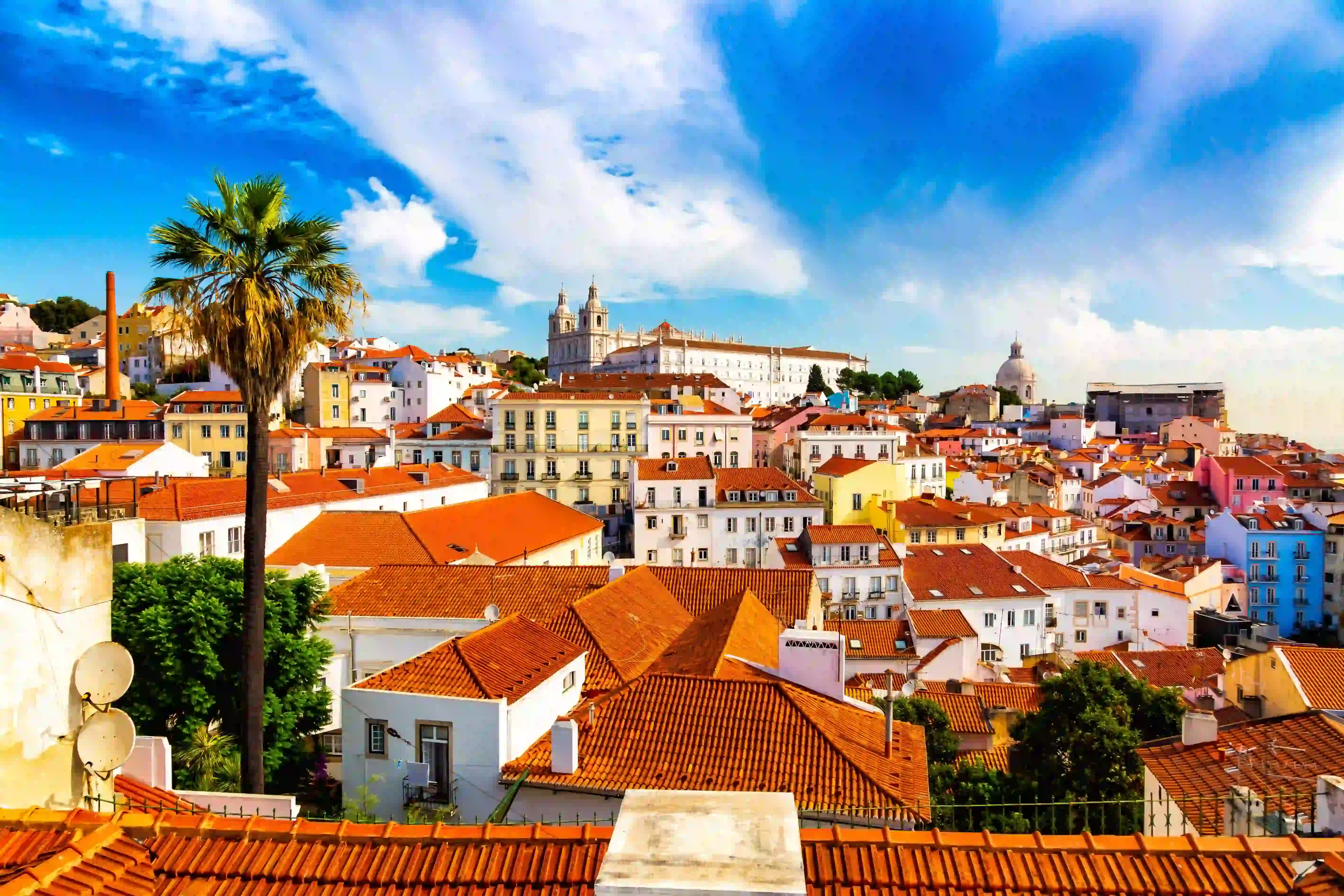 A rooftop view over a city in Portugal with vibrant colors and traditional architecture.